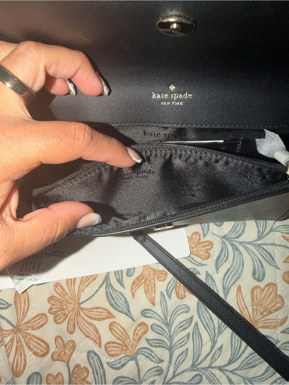 kate spade black saffiano leather flap wallet with gold plaque